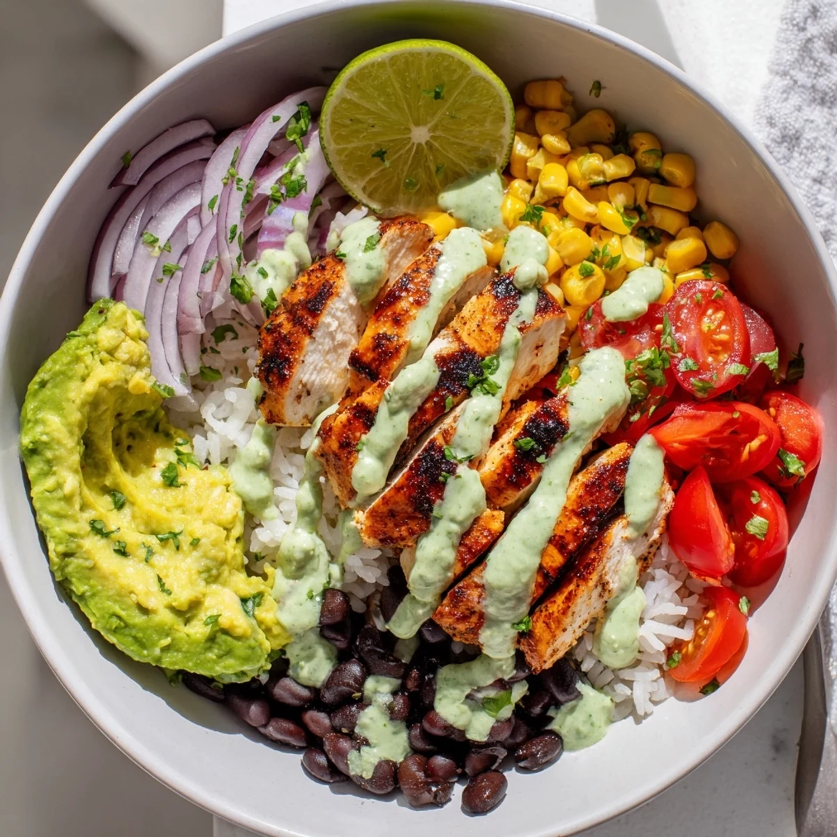 Juicy Zesty Lime Cilantro Chicken Bowls with vibrant veggies and drizzled sauce.  