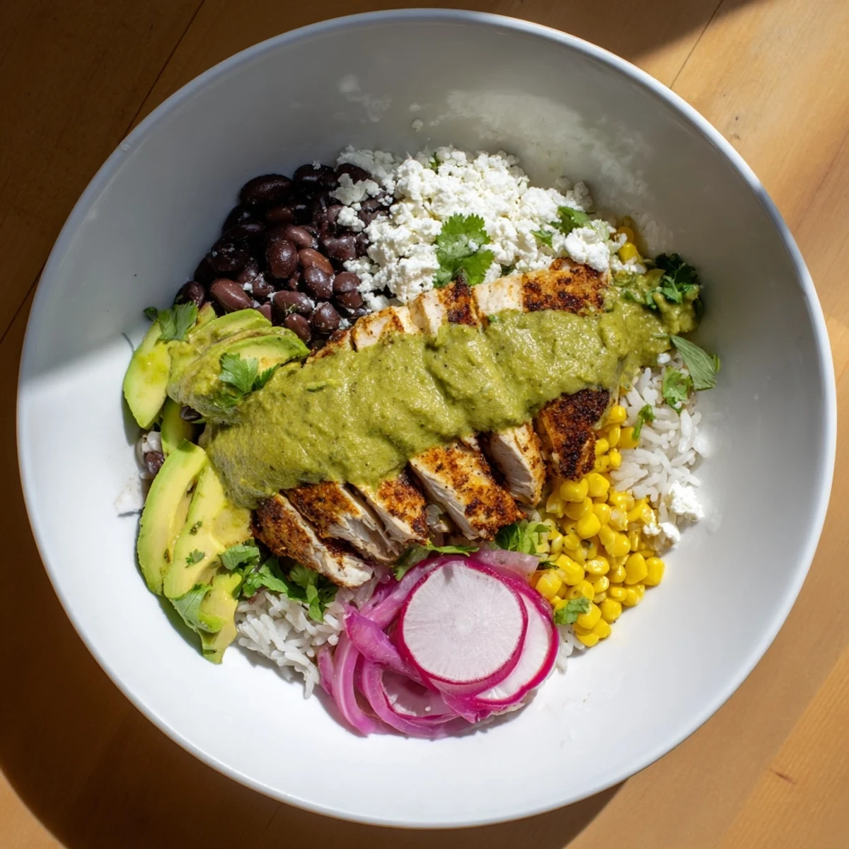 Flavorful Green Enchiladas Rice Bowl with tender chicken, avocado, and fresh cilantro, a delicious meal.