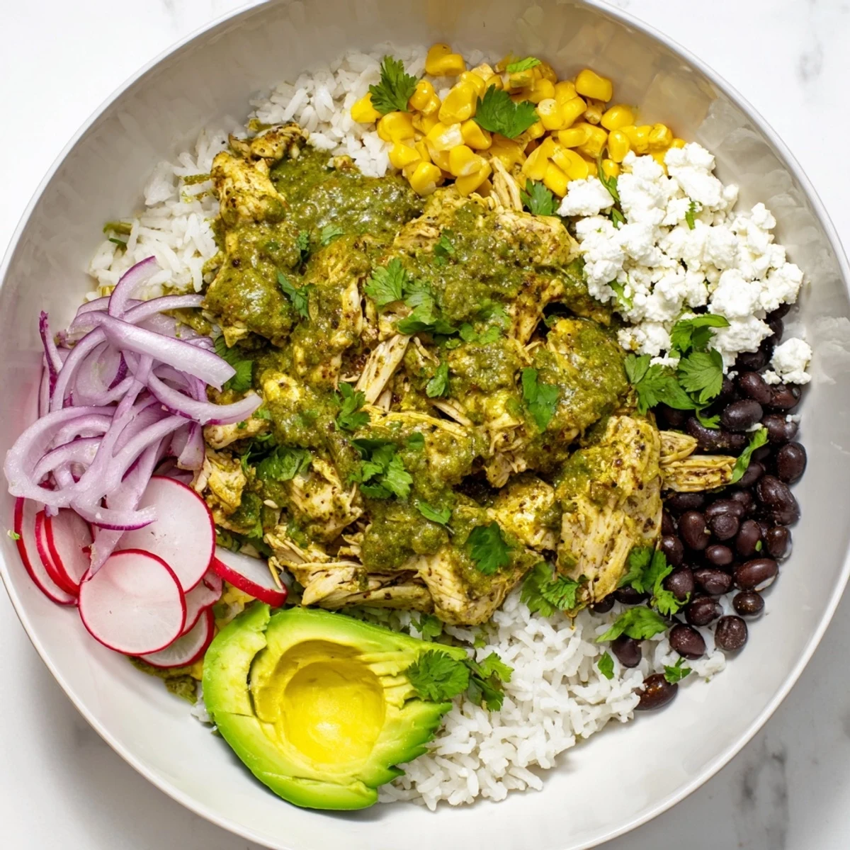 Textured image of a Green Enchiladas Rice Bowl, showcasing rice, chicken, and colorful toppings in bowls.
