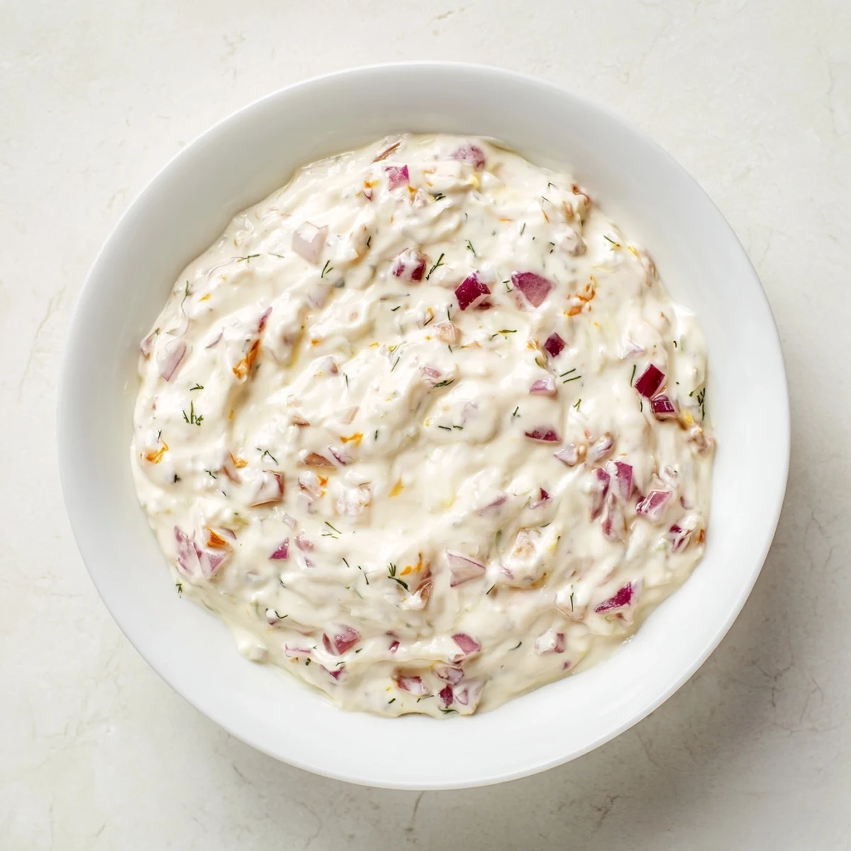 Creamy sweet and sour pickle relish dip, ready to be scooped up with crunchy tortilla chips.