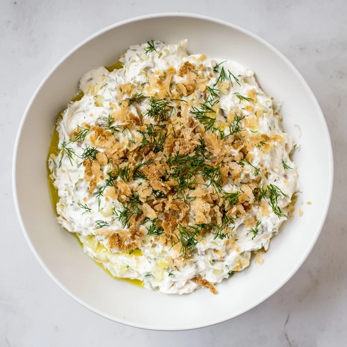 Creamy fried pickle dip: a delightful, savory appetizer with visible chopped pickles throughout.