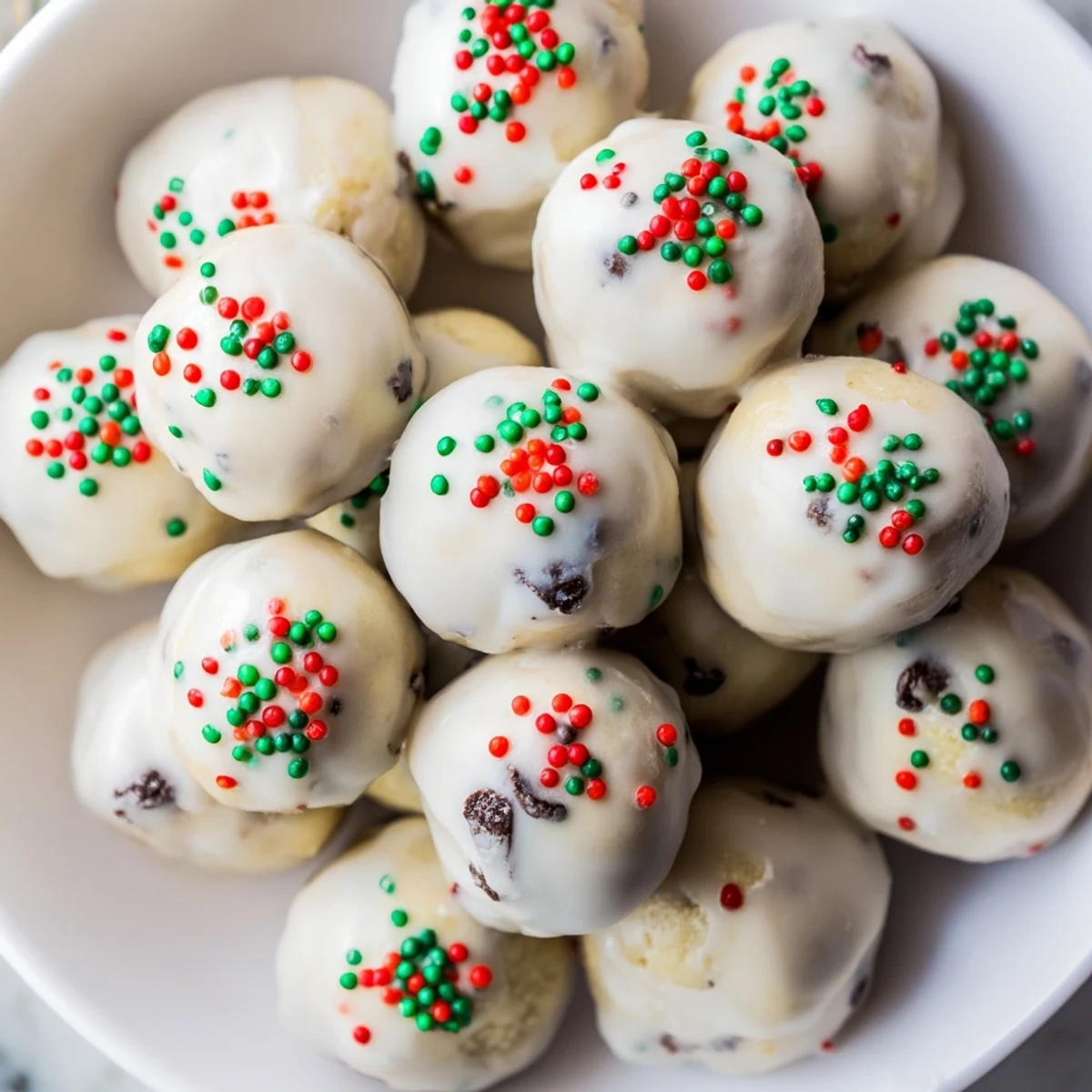 Golden-brown Protein-Packed Italian Christmas Cookie Balls dusted in a sweet glaze and festive sprinkles.
