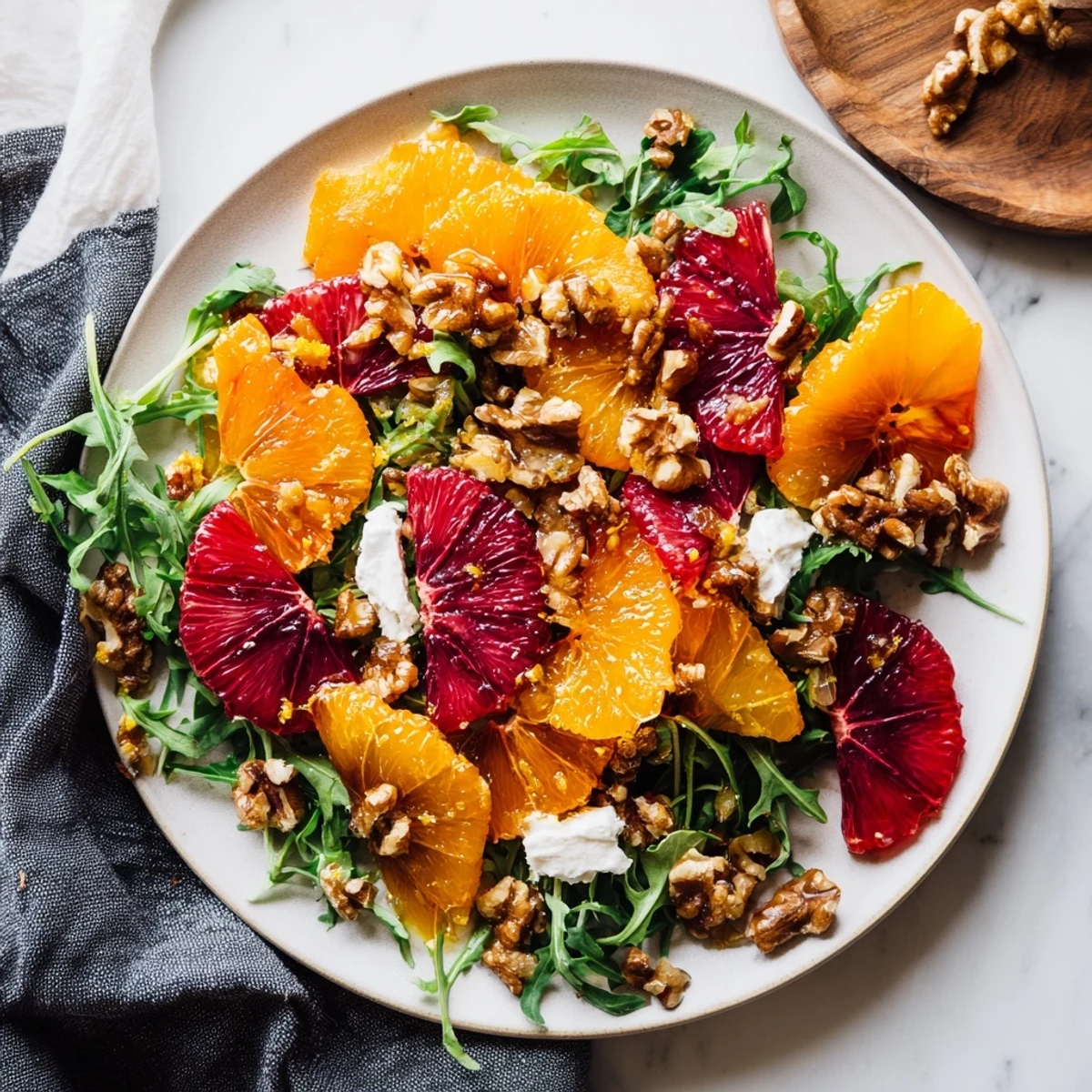 Winter Citrus & Candied Pecan Salad, showcasing vibrant orange and grapefruit slices, ready to combine with greens.