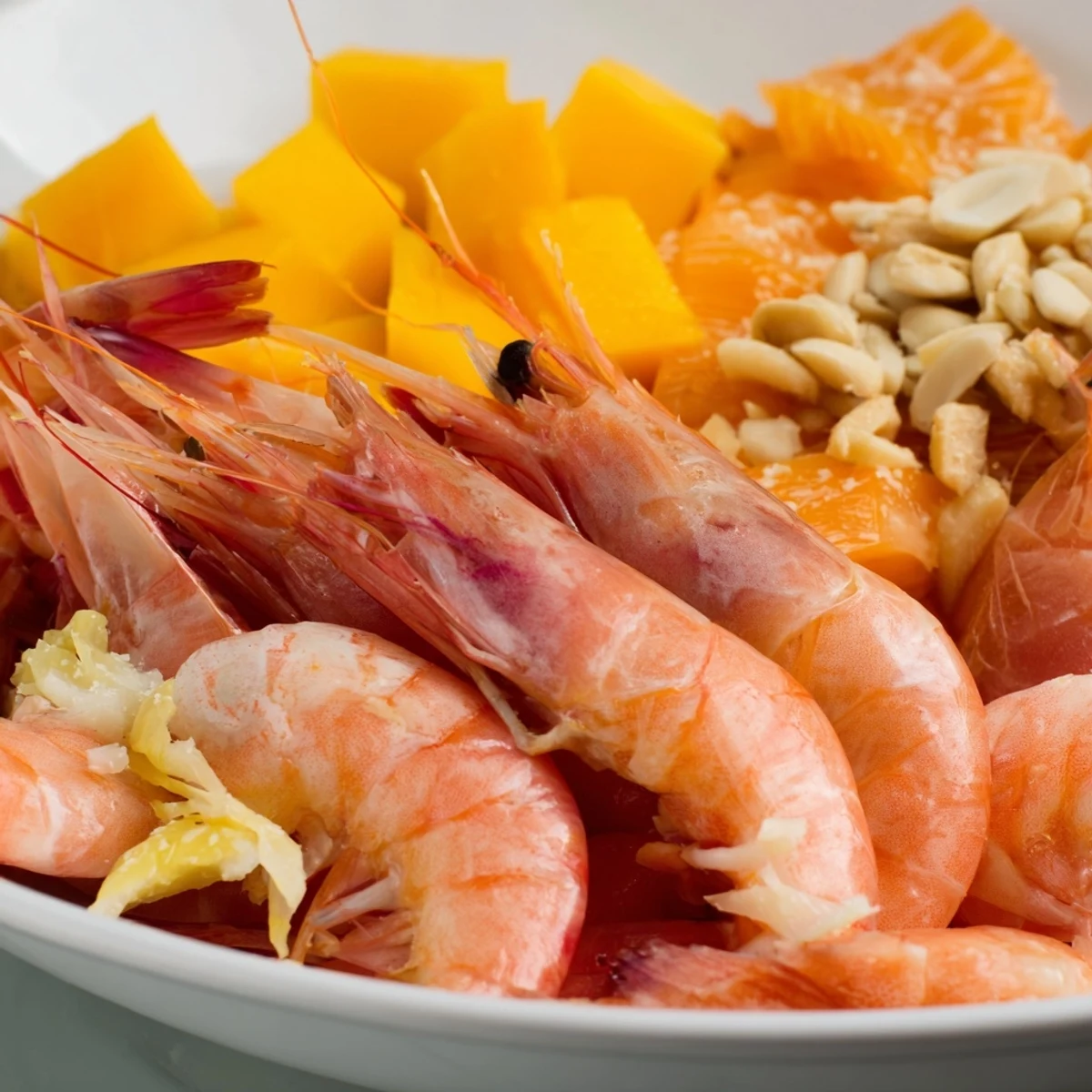 Vibrant Tropical Wave Tasting Platter with juicy shrimp, ripe mango, and drizzled sweet chili sauce.