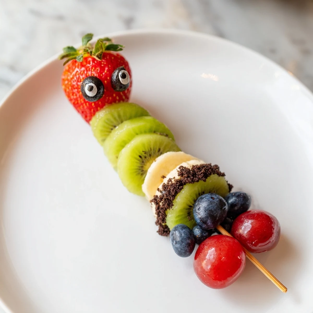 Close-up of a delightful Caterpillar Fruit Skewer Track, featuring a healthy and fun colorful snack on skewers.