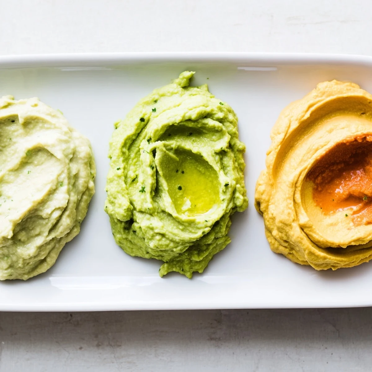 This Dip Trio offers creamy avocado, roasted red pepper, plus turmeric hummus: a flavor explosion!