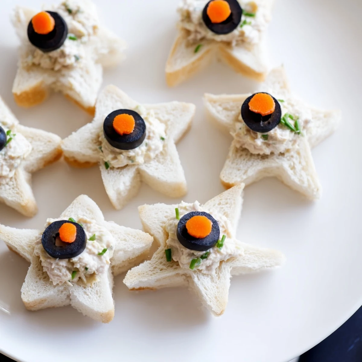 Mini Starfish Sandwiches featuring creamy tuna filling, shaped for fun appetizers, ready to enjoy.