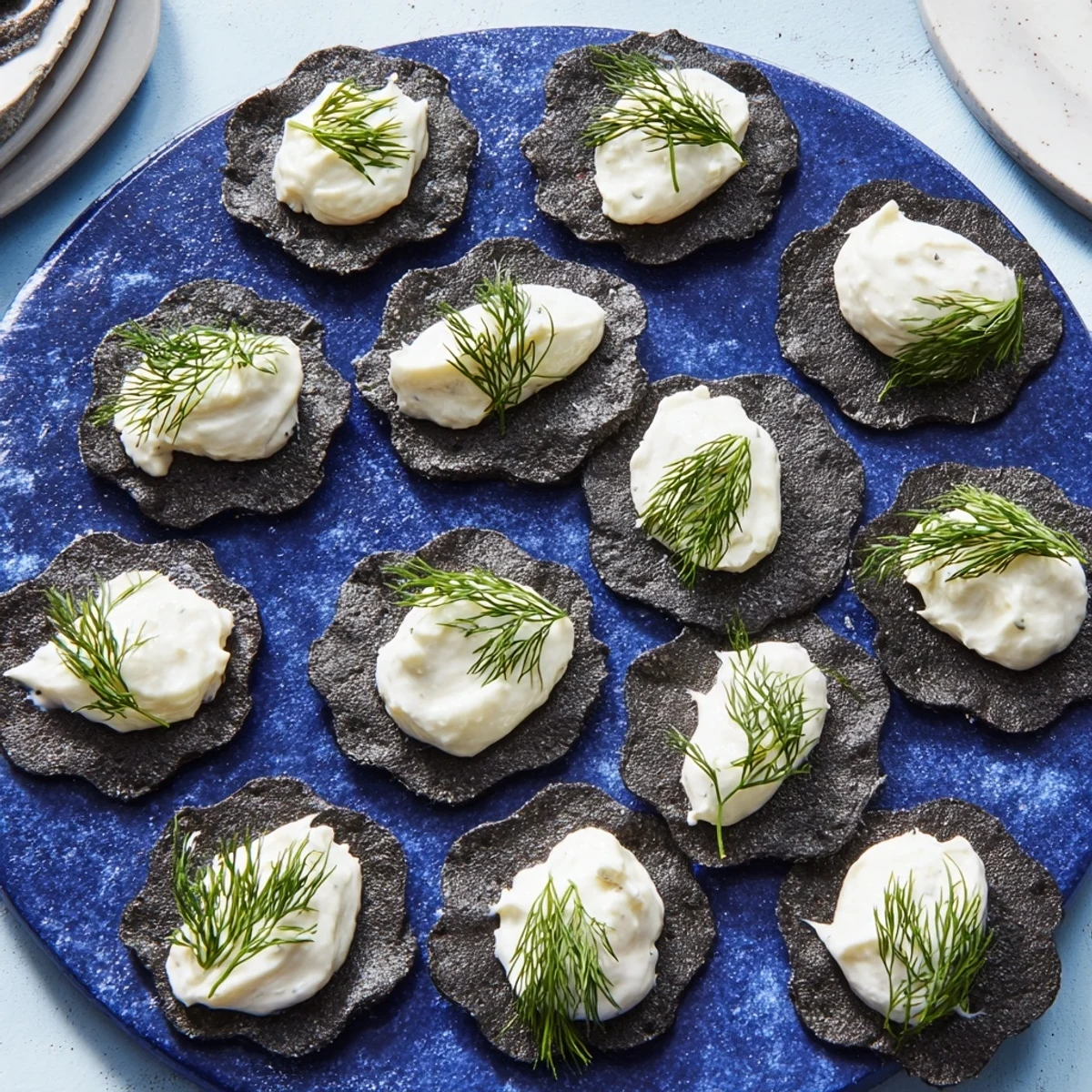 Delicious "Stormy Sea" appetizer, featuring creamy goat cheese "whitecaps" atop wavy grey crackers.