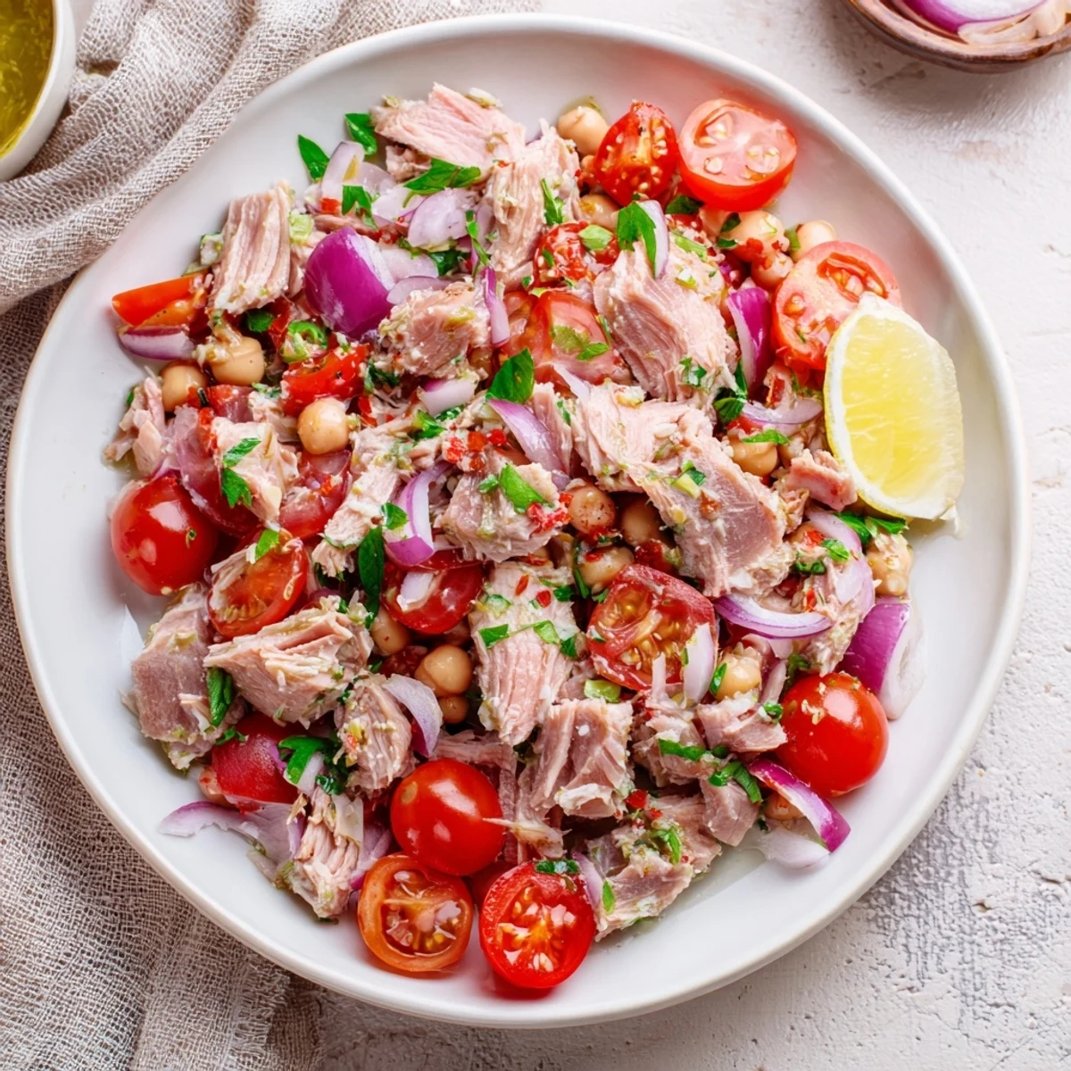 Flaky tuna and creamy chickpeas combine in this vibrant Dense Chickpea and Tuna Salad.