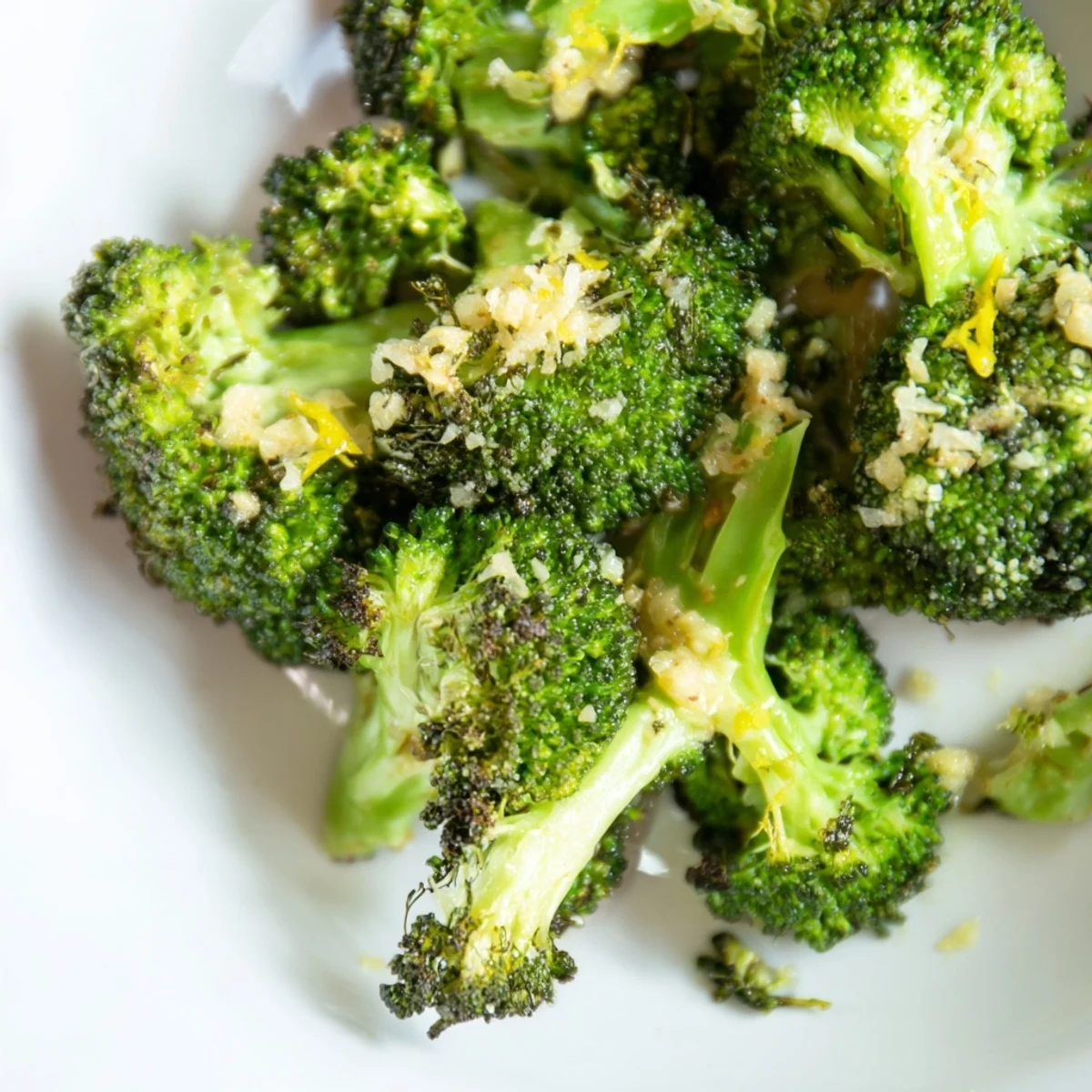 Golden brown Lemon Garlic Roasted Broccoli, ready to serve with a squeeze of fresh lemon juice.