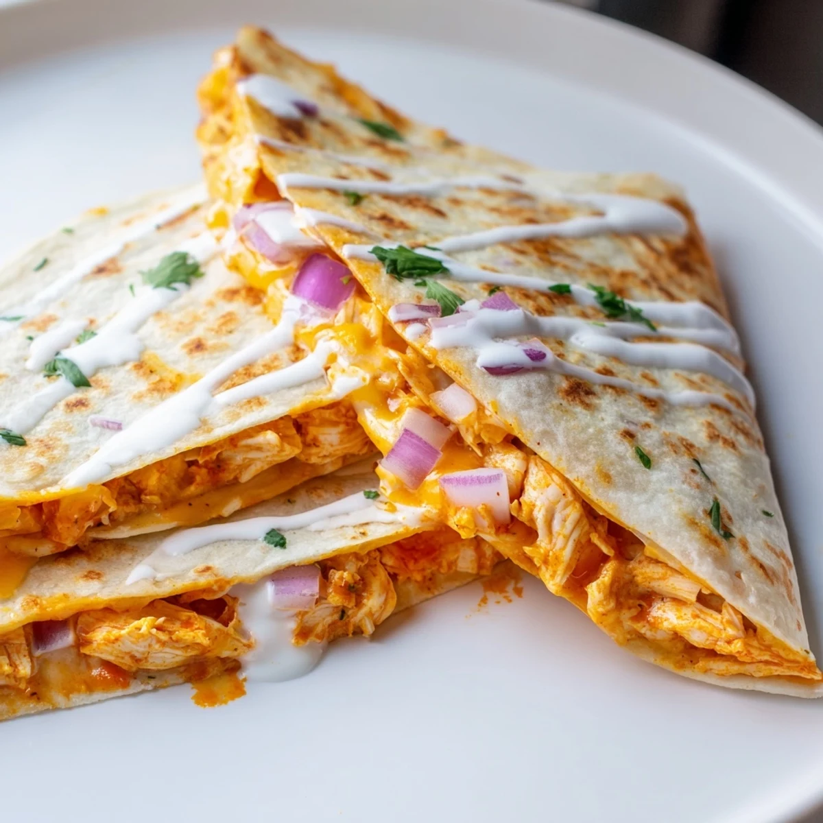 Golden Buffalo chicken quesadilla, cheesy and spicy, ready for a delicious game-day snack.