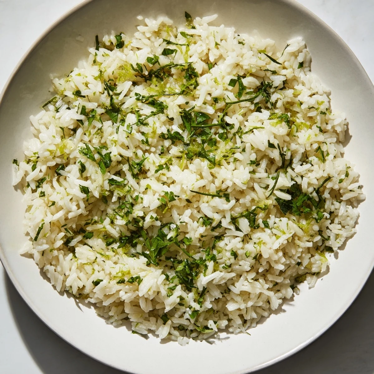 Steaming bowl of Cilantro Lime Rice with bright green flecks, ideal alongside tacos.