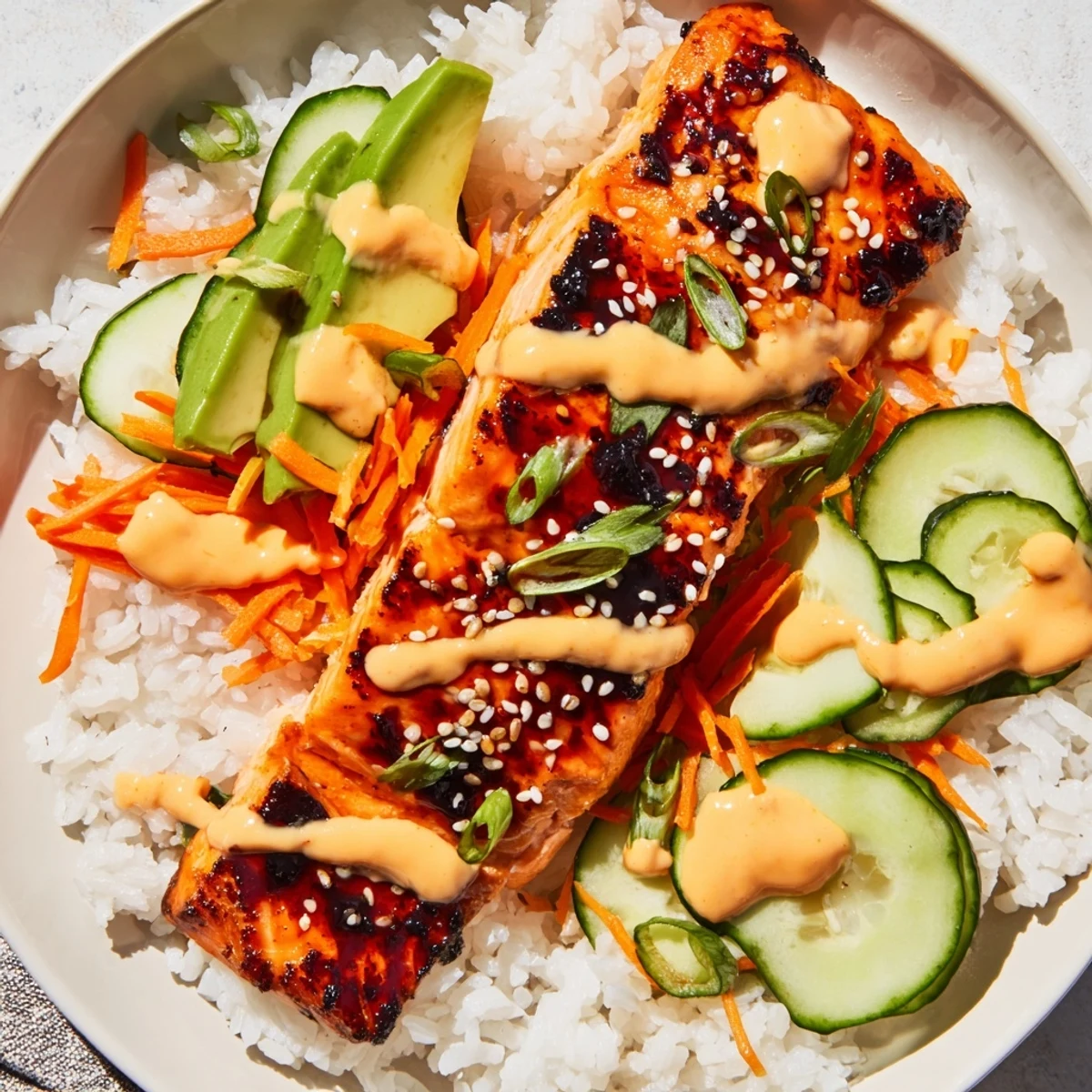 Steaming, flavorful teriyaki salmon rice bowl with vibrant vegetables, waiting to be enjoyed.