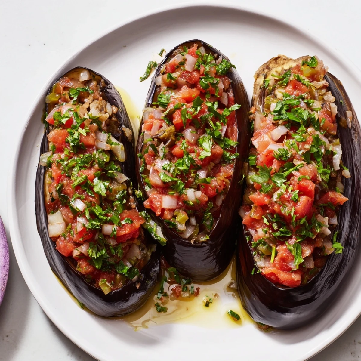 A close-up of baked Imam Bayildi, the Turkish eggplant dish, rich with vibrant flavors.