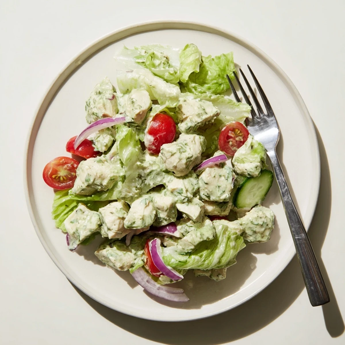 Freshly grilled chicken chunks tossed in creamy jalapeño ranch dressing over crisp romaine lettuce with tomatoes and cucumbers.
