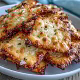 Golden homemade Garlic Parmesan Sourdough Cheez-Its with crispy edges and a rich, cheesy bite, perfect for snacking or entertaining.