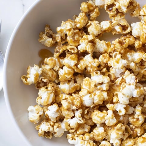 Cinnamon Hot Honey Popcorn drizzled with sweet glaze, perfect for cozy movie nights.  