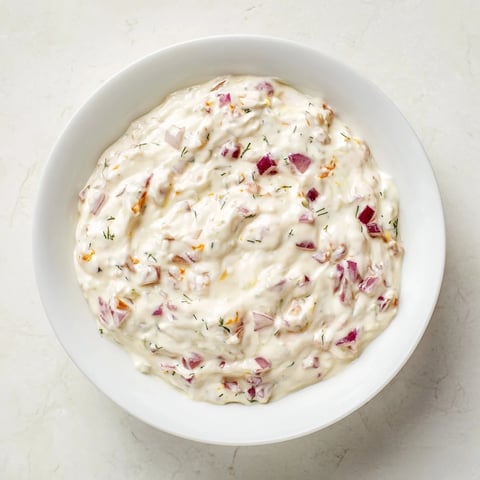 Creamy sweet and sour pickle relish dip, ready to be scooped up with crunchy tortilla chips.