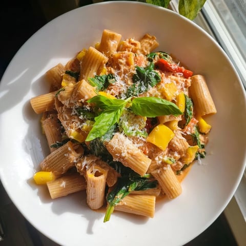 Creamy Lightened-Up Vodka Rosé Christmas Pasta, vibrant red peppers and spinach make a delicious holiday main.