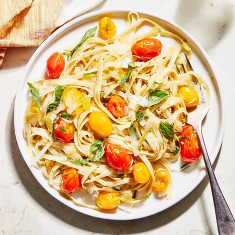 A delicious, inviting shot of the finished Cozy Fireplace One-Pan Tomato Basil Pasta, ready to serve.