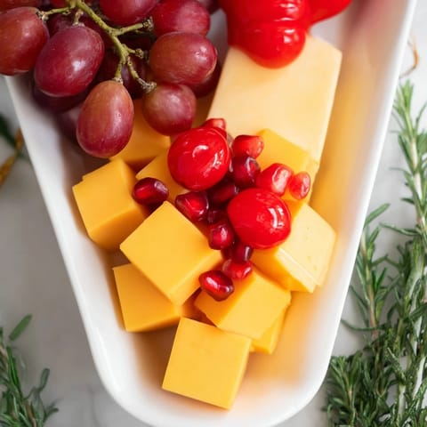 Festive Christmas Stocking Snack Tray, a visually exciting arrangement featuring cheese, salami, and fresh produce.