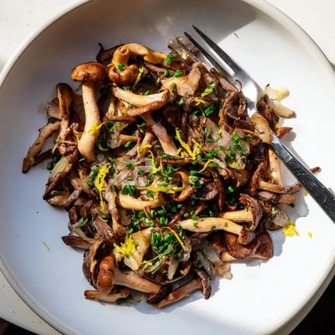 Savory Enchanted Forest Mushrooms, a French side dish, cooked with white wine and garlic aromas.