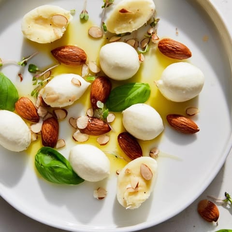 Savory The Polished Pebble, a whimsical appetizer with creamy cheeses, almonds and fresh basil.