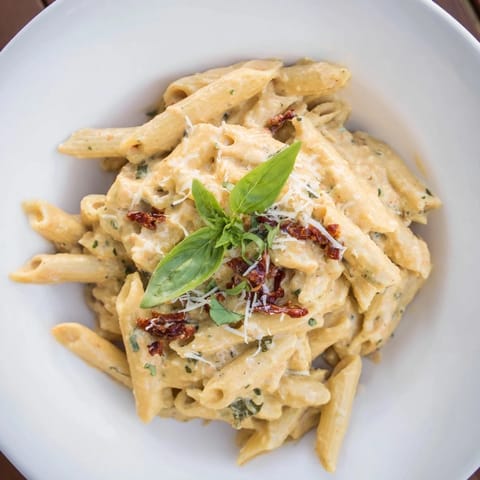 Vibrant image of the rich Sun-Dried Tomato & Cottage Cheese Pasta Sauce, ready to be served over pasta.