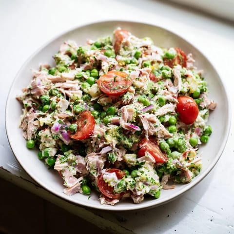 Fresh parsley and ruby red onion garnish this delicious Dense Chickpea and Tuna Salad.