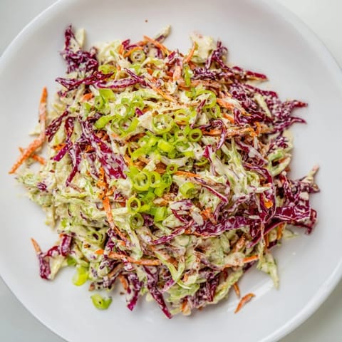 Homemade Quick Coleslaw Salad, a refreshing side dish: crisp vegetables with tangy, creamy dressing, ready to enjoy.