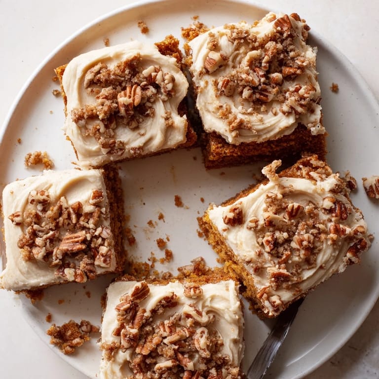 Perfectly frosted Pumpkin Bars with cream cheese, inviting textures ready to deliver a fall flavor.