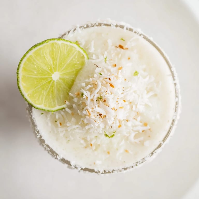 This White Christmas Margarita Slush features a beautifully blended, snowy texture, ideal for holiday festivities.