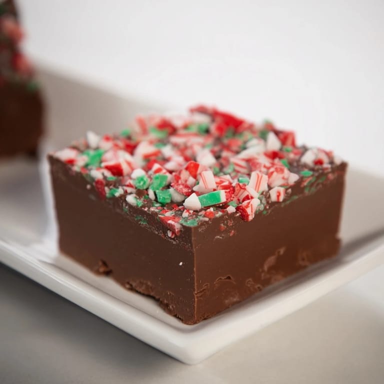 Homemade 3-Ingredient Christmas Fudge Squares, rich chocolate treat, perfect for gifting or a sweet craving.