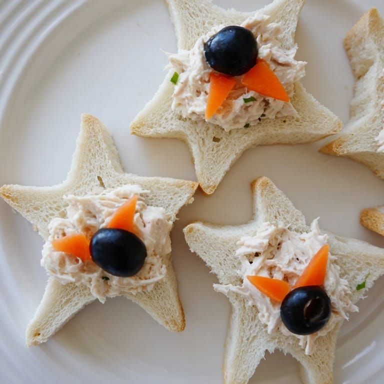 Adorable Mini Starfish Sandwiches, piled high with tuna salad, perfect for a kids' party or snack.