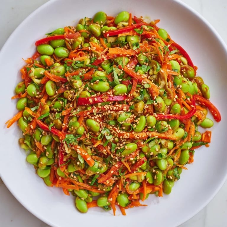 Close-up of Asian Edamame Salad, featuring colorful vegetables and a tangy sesame ginger dressing.