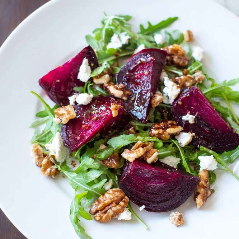 Showcasing colorful Roasted Beet Walnut Salad with candied walnuts and balsamic vinaigrette, ready to serve.