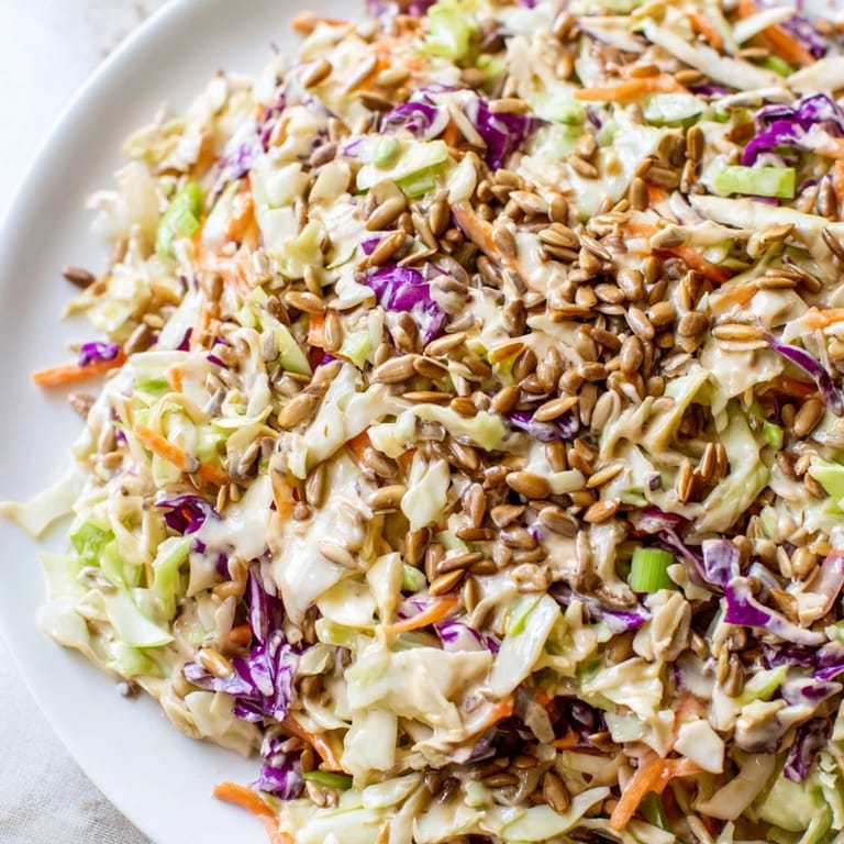 A bright, refreshing side: creamy crunchy coleslaw salad ready to serve and enjoy at lunch.