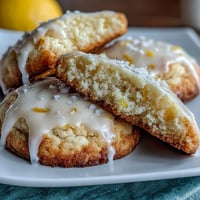 Close-up of cottage cheese lemon sugar cookies with glaze, soft and moist with a bright citrus aroma, perfect for a refreshing dessert.