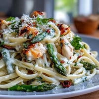 Roasted asparagus and tender chicken tossed with linguine in a creamy Asiago cheese sauce.